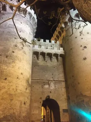 an old building with an archway in front at Heart of trendy area of Russafa with lovely terrace ! au coeur de Ruzafa avec belle terrasse ! in Valencia
