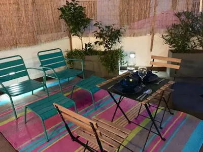 a room with chairs and a table and a table and chairs at Heart of trendy area of Russafa with lovely terrace ! au coeur de Ruzafa avec belle terrasse ! in Valencia
