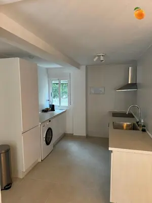 a kitchen with a sink and a washing machine at Fully private villa for 12p with large pool in Valencia-Náquera in Náquera