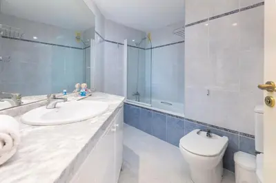 a bathroom with a sink and a toilet and a shower at Travel Hábitat L'Umbracle in Valencia
