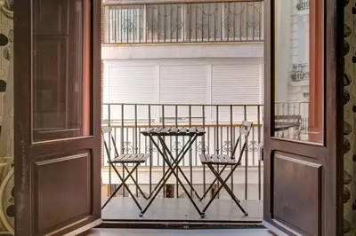 a living room with a sliding glass door and a table at Apartamento REPESO in Valencia