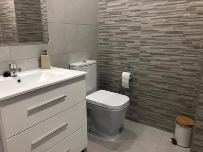 a bathroom with a white toilet and a sink at centrico cerca al ayuntamiento+luminoso+acogedor in Valencia