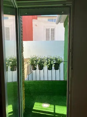 a view of a balcony with potted plants on a fence at Hermoso flat de playa in Valencia