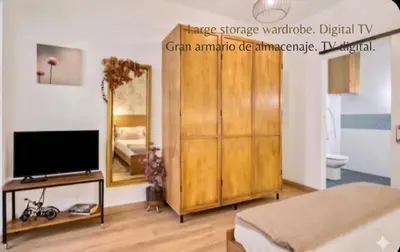 a wooden shelf with jars of food on it at URBAN LOFT VALENCIA in Valencia