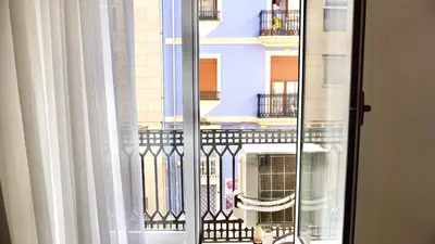 a window with a view of a building at Cervantes Prime in Valencia