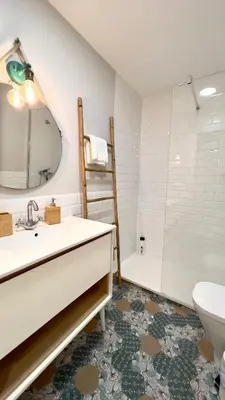 a bathroom with a sink and a toilet and a shower at Cervantes Prime in Valencia