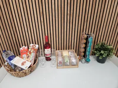 a table with a basket of food and a bottle of wine at Cervantes Prime in Valencia