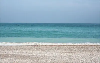 an empty beach with the ocean in the background at 2 Bedroom Nice Apartment In Moncofa in Moncófar