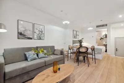 a living room with a couch and a table at Limehome Valencia Carrer del Pare Palau i Quer in Valencia