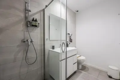 a bathroom with a shower and a sink and a toilet at AmazINN Valencia Cabanyal 3B in Valencia