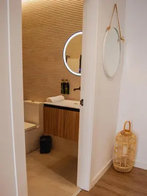 a bathroom with a sink and a mirror at Demetrio By Alma Suites in Valencia