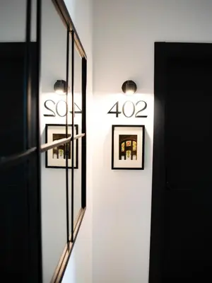 a hallway with two framed pictures on a wall at Demetrio By Alma Suites in Valencia