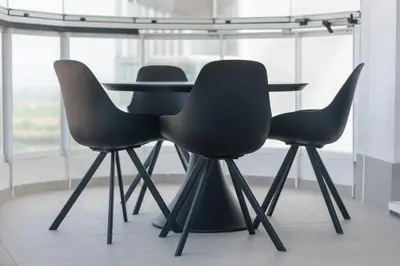 three chairs and a table in a room at Moderno apartamento con 2 terrazas en Gran Canet by Global Vacacional in Canet de Berenguer