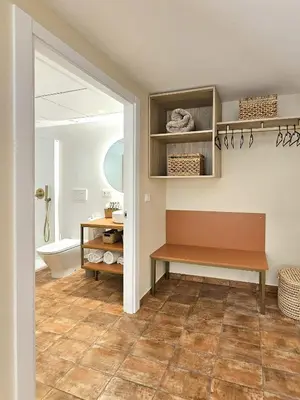 a bathroom with a bench and a toilet at Apartamentos Las Ciencias Studio Y in Valencia