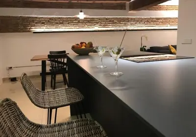 a bar with two glasses of wine on a counter at Estudio Pau @VALENCIAYOLE in Valencia