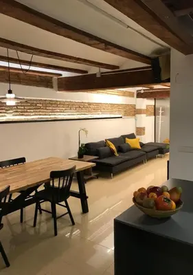 a living room with a table and a couch at Estudio Pau @VALENCIAYOLE in Valencia