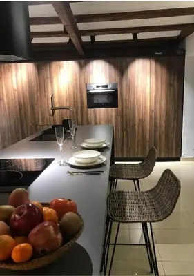 a kitchen with a table with a bowl of fruit on it at Estudio Pau @VALENCIAYOLE in Valencia
