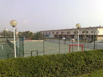 a tennis court with two tennis courts at Modern Penthouse-duplex Facing The Sea in La Torre
