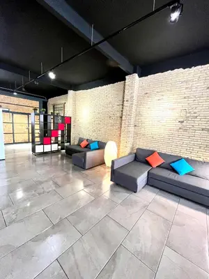 a living room with couches and a brick wall at IY Loft 4 - Open Plan Garage Style - Up to 4 people in Valencia