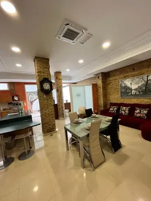 a living room with a table and a couch at IY Loft 5 - Spacious Loft in the Old Town in Valencia