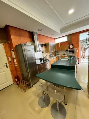 a kitchen with a green table and a sink at IY Loft 5 - Spacious Loft in the Old Town in Valencia