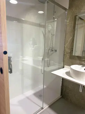 a bathroom with a shower and a sink at Almar 52 Suites in Valencia