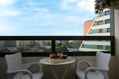 a balcony with a table and chairs in front of a window at SingularStays Alameda II in Valencia