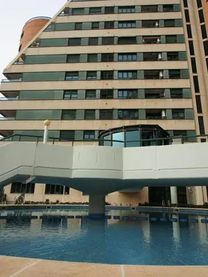 a large building with a bridge over a body of water at SingularStays Alameda II in Valencia