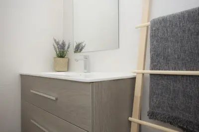 a bathroom with a sink and a mirror at SingularStays Calderon in Valencia