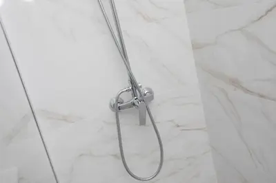 a shower with a shower head in a bathroom at SingularStays Guillem Sorolla in Valencia