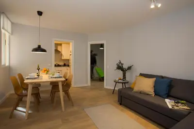 a living room with a couch and a table at SingularStays Quevedo II in Valencia