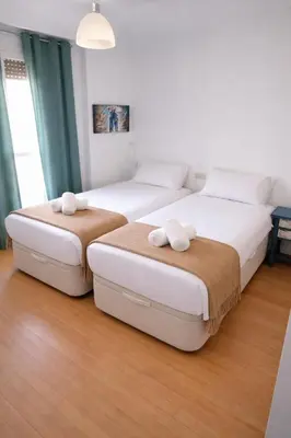 a room with a desk with a computer and stool at SingularStays Reina II in Valencia
