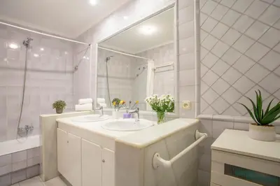 a bathroom with two sinks and a mirror at SingularStays Reina II in Valencia