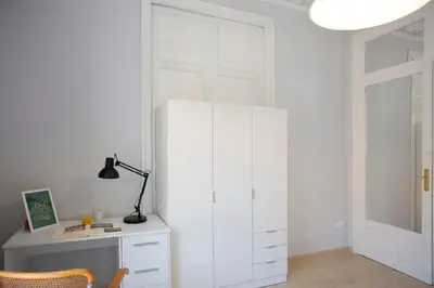a room with a white cabinet and a desk at SingularStays Salvador IV in Valencia