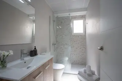 a bathroom with a sink and a toilet and a shower at SingularStays Campanar in Valencia