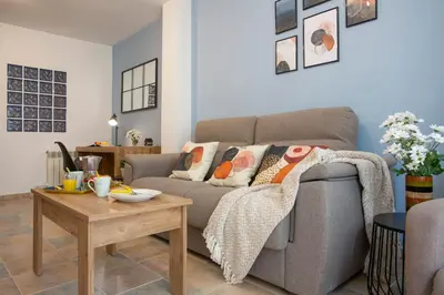 a living room with a couch and a table at SingularStays Clero in Valencia