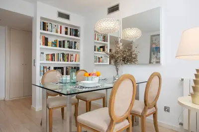 a dining room with a glass table and chairs at SingularStays Oceanografico II in Valencia
