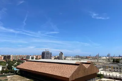 a view of a city with a building and buildings at SingularStays Oceanografico II in Valencia