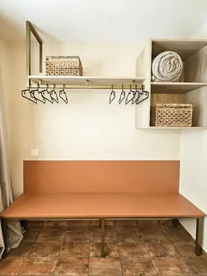 a bench in a room with shelves and baskets at Apartamentos Las Ciencias Studio Z in Valencia