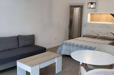 a living room with a couch and a table at Estudio diseño cerca Ciudad Ciencias VT-55211-V in Valencia