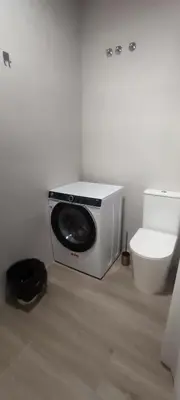a white bathroom with a toilet and a speaker at Estudio diseño cerca Ciudad Ciencias VT-55211-V in Valencia