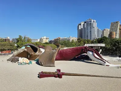 a sculpture of a woman is laying on the ground at Apartamentos Las Ciencias U in Valencia
