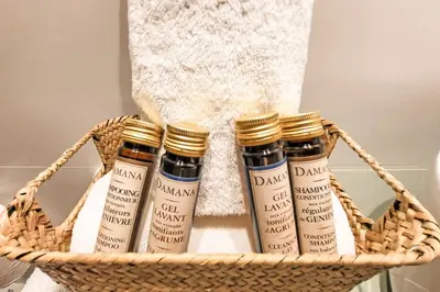 a basket with four bottles of essential oils at Apartamentos Las Ciencias V in Valencia