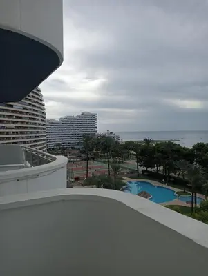 a view of a pool from the balcony of a building at LAS VEGAS, esc-1, 7-14 in Cullera