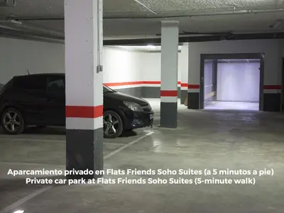 a parking garage with a car parked in it at Flats Friends Torres Quart in Valencia