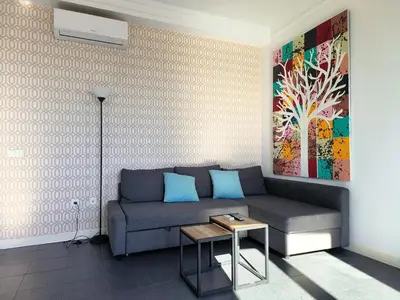 a living room with a couch and a table at Flats Friends Torres Quart in Valencia