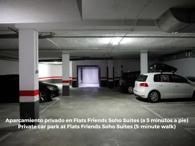 a parking garage with cars parked in it at Flats Friends Torres Quart in Valencia