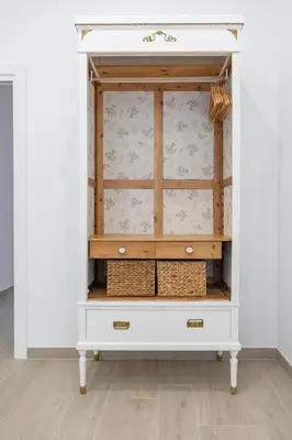 a white hutch with drawers and baskets at Ca Celieta Beach I in Valencia