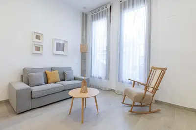a living room with a couch and a chair at Ca Celieta Beach I in Valencia