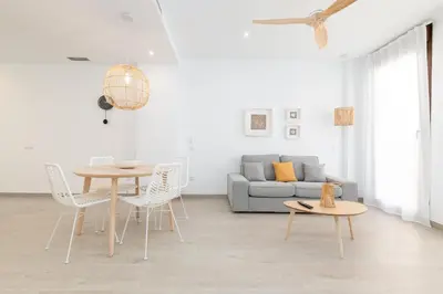 a living room with a table and a couch at Ca Celieta Beach II in Valencia